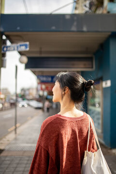Young adult asian woman exploring the inner west urban streets of Sydney