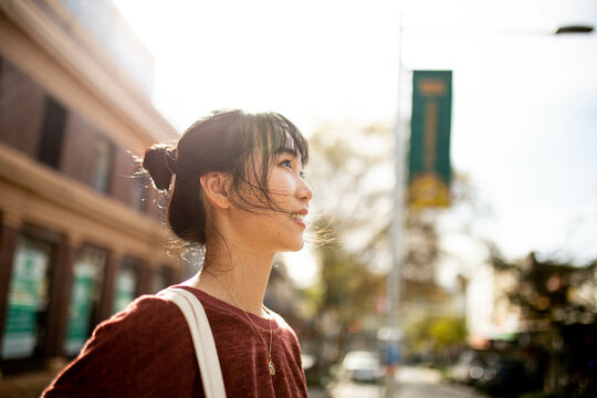 Young adult asian woman exploring the inner west urban streets of Sydney
