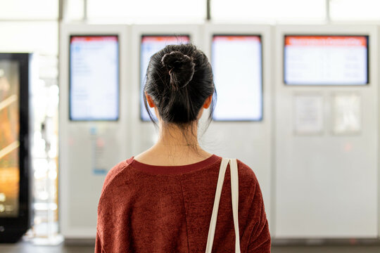 Asian young adult woman at a Sydney train station