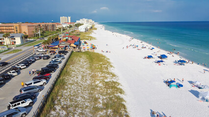 Aerial view Scenic Gulf Drive toward Miramar Beach east of Destin with public parking, waterfront houses, restaurant and access to miles of white sandy beaches, turquoise water, Destin, Floria