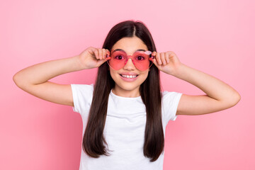 Photo portrait of cute schoolgirl touch glasses specs shopping mall wear trendy white outfit isolated on pink color background