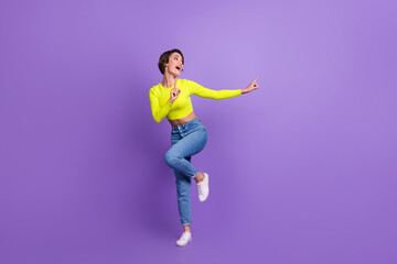 Full length photo of lovely cheerful overjoyed person enjoy dancing partying good mood isolated on...