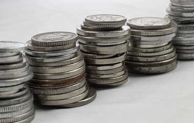 Silver coins from different countries and times - coin towers - macro photography