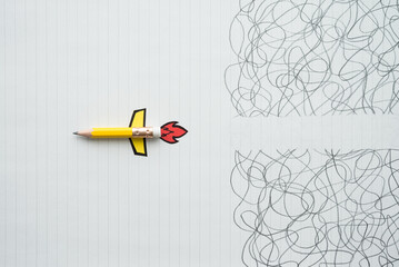 Pencil rocket fly break through confuse zone on white line paper background. Breaking through...