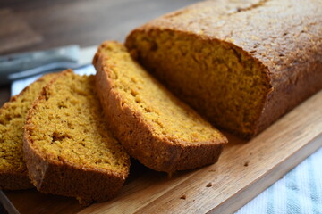 sliced pumpkin bread on a wooden board