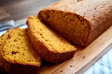 sliced pumpkin bread on a wooden board