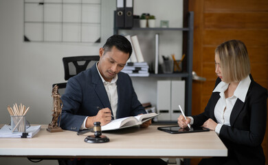 Partner lawyers or attorneys discussing a contract agreement. Successful businessmen have a contract in place to protect it,signing of modest agreements form in office