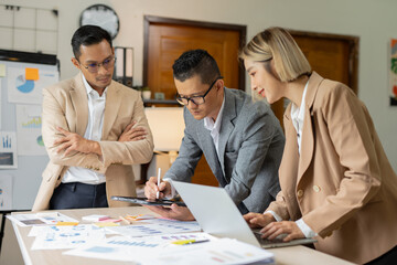 Asian businessmen, women and men Talk about new projects, presents at home office.