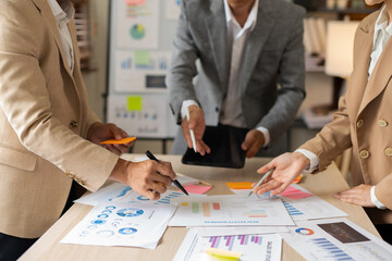 Asian businessmen, women and men Talk about new projects, presents at home office.