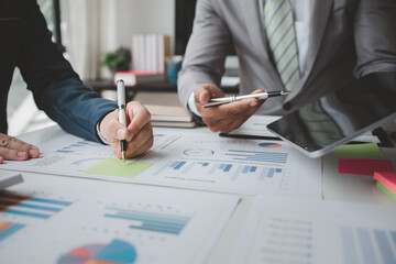 Atmosphere of a startup company meeting, business people are meeting together to summarize and plan investment finances, they are the founders of the company. Business administration concept.