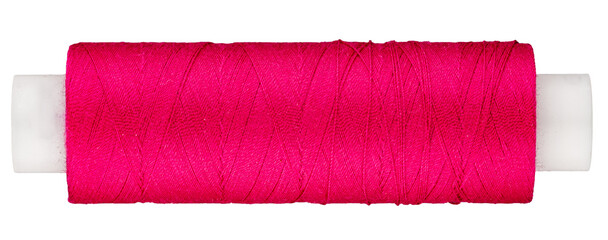 Spool with pink thread for sewing, supply for sewing, isolated object 

