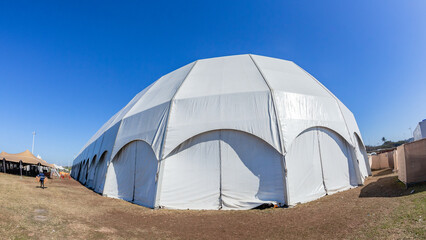 Large Tent Portable Dome White Canvas Structure Entertainment Structure Close-up Blue Sky. 