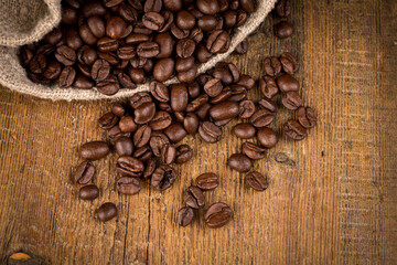 Coffee beans on grunge wooden background
