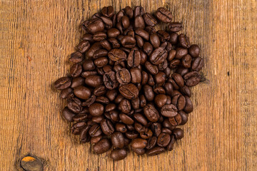 Coffee beans on grunge wooden background