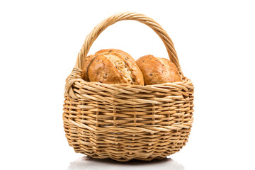 bread in wicker basket isolated on white
