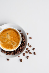 Cup of Hot Coffee and beans on White Background