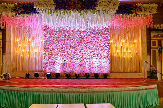 wedding indian stage. elegance wedding stage decorations. Flowers and lights. Luxury wedding stage 