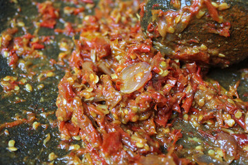 Sambal is an Indonesian chilli sauce or paste, made from red chili pepper and onion, mashed by stone mortar and pestle.