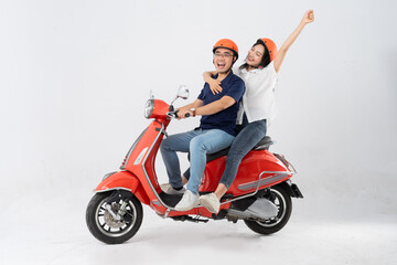 image of asian couple riding scooter on white background