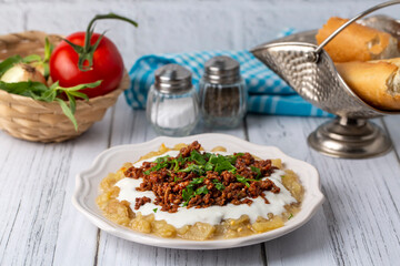 Turkish Ali Nazik Kebab with Yogurt, Minced Meat and Roasted Eggplant or Aubergine Kebap.