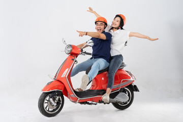 image of asian couple riding scooter on white background