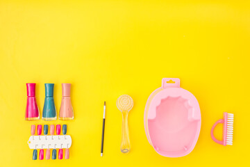 Bright gel varnishes with manicure and pedicure beauty tools, top view