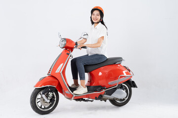Plakat full body photo of a woman wearing a hairdresser and driving a motorbike