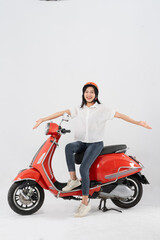 Plakat full body photo of a woman wearing a hairdresser and driving a motorbike