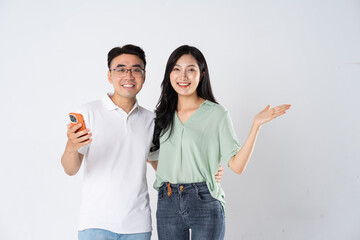 a couple posing on a white background