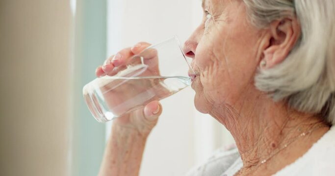 Healthy, hydration and senior woman drinking water for wellness and liquid diet detox at home. Thirsty, fresh and calm elderly female person enjoying glass of cold drink in modern retirement house.