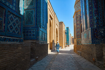 Tourist in Mausoleums of the Shakhi Zinda complex in Samarkand, Uzbekistan