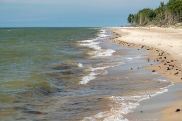 The sandy shore of the Baltic Sea. Wide coastal area and dunes.