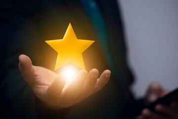 Businessman holding golden star model in hand The coolest business service ideas that rate the...