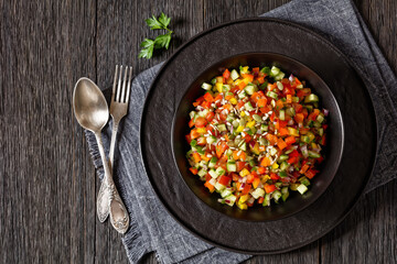 Israeli salad of finely diced veggies in bowl
