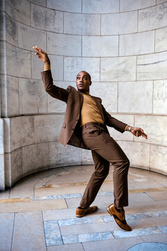 Man in business suit dancing