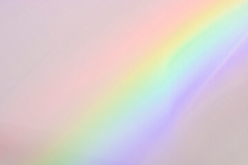 Flash on the wall. Blurred rainbow light. Dispersion. Decomposition of light into spectral colors.