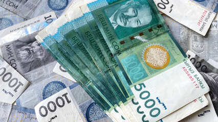 Money in 5000 SOM is on 1000 som bills. Economics and finance. Kyrgyz national currency. Economics...