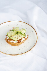 Vegan sandwich with cucumber and sun-dried tomato paste