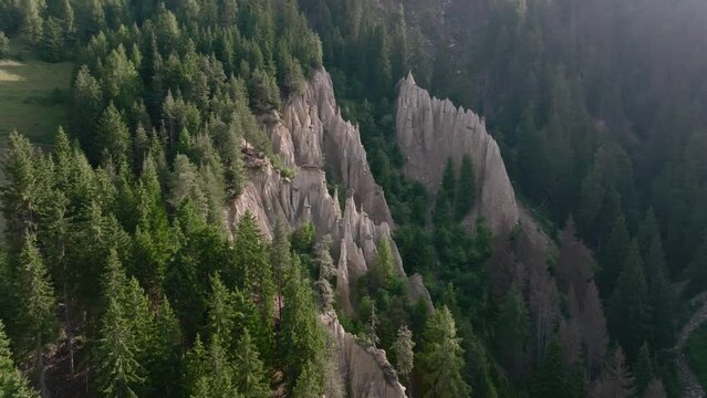Aerial Drone shot over the Earth pyramids of Platten in South Tyrol in Alps near to Bruneck or Brunico, Bolzano, Italia
