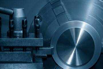 Closeup scene the lathe machine finish cut the brass parts by lathe tools.
