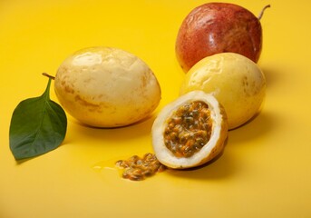 Vibrant still life featuring an assortment of fresh passion fruits placed side by side