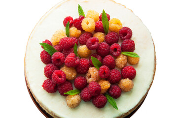 sponge cream cake with ripe red and yellow raspberries. fresh, colorful and delicious dessert with juicy raspberries and sweet whipped cream. The concept of home baking fruit
