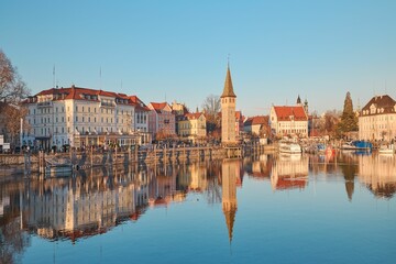 the view from across a large body of water, with buildings lining the edge and