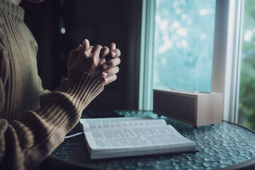 Man read the holy Bible and pray in morning.