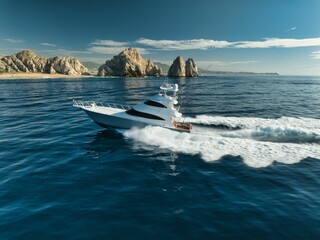 Elegant sportfishing yacht in the ocean in Cabo, Mexico sailing leisurely through a tranquil bay © Ah360/Wirestock Creators