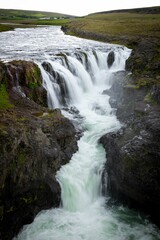 Fototapeta na wymiar Breathtaking view of a majestic Kolufoss waterfall at Kolugljufur canyon in Iceland