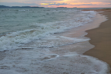 Raging Sea with Sunset Sky Background