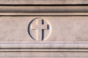 Cross carved on a white stone wall