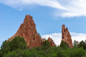 Fototapeta na wymiar Majestic mountain range with towering red sandstone formations with a sky of brilliant blue hues