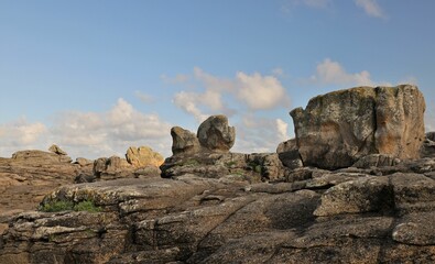 Fototapeta na wymiar Scenic landscape featuring large rocks situated in the center of a coast, Brittany, France
